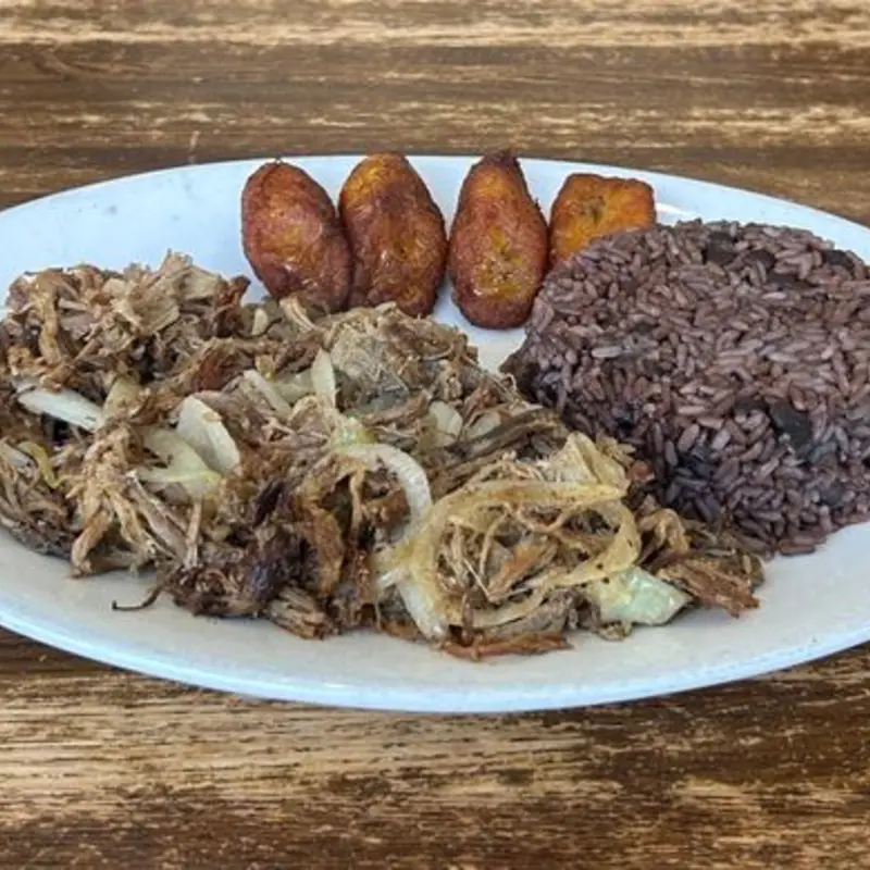 Shredded beef, seasoned and cooked with onions until crispy, topped with mojo sauce.
