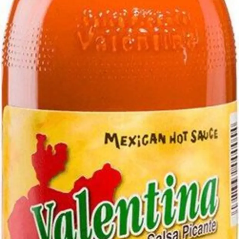 Valentina Mexican Hot Sauce is a classic condiment known for its tangy and spicy kick, perfect for adding flavor to your favorite dishes. It's versatile enough to sprinkle on everything from tacos and burritos to popcorn and French fries. at Tortilleria Y Taqueria La Bamba 1232 N Tamiami Trl SUITES 11-8 | Toast