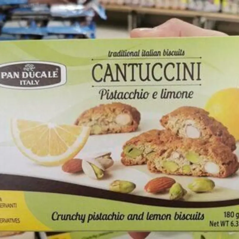 Enjoy a delightful snack with Cantuccini Mandorla Pistachio Biscotti, combining the gentle crunch of almonds and the subtle nuttiness of pistachios. Perfect for pairing with your favorite coffee or tea.