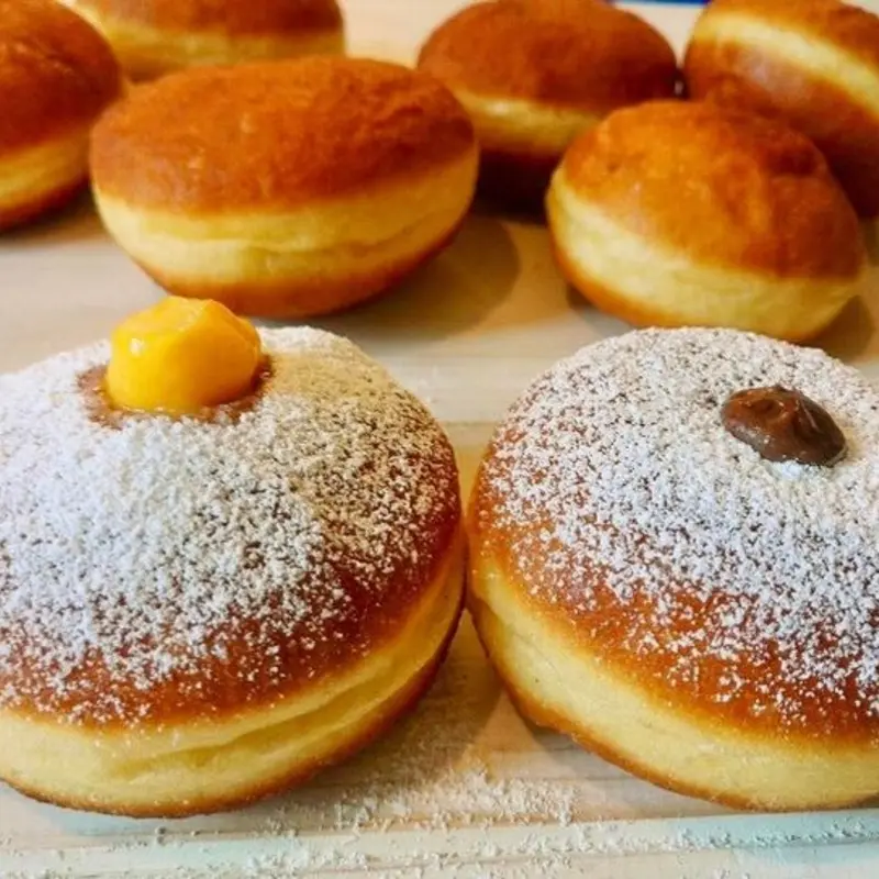 Fluffy Italian doughnut fried to perfection and dusted with sugar—an irresistible breakfast treat.