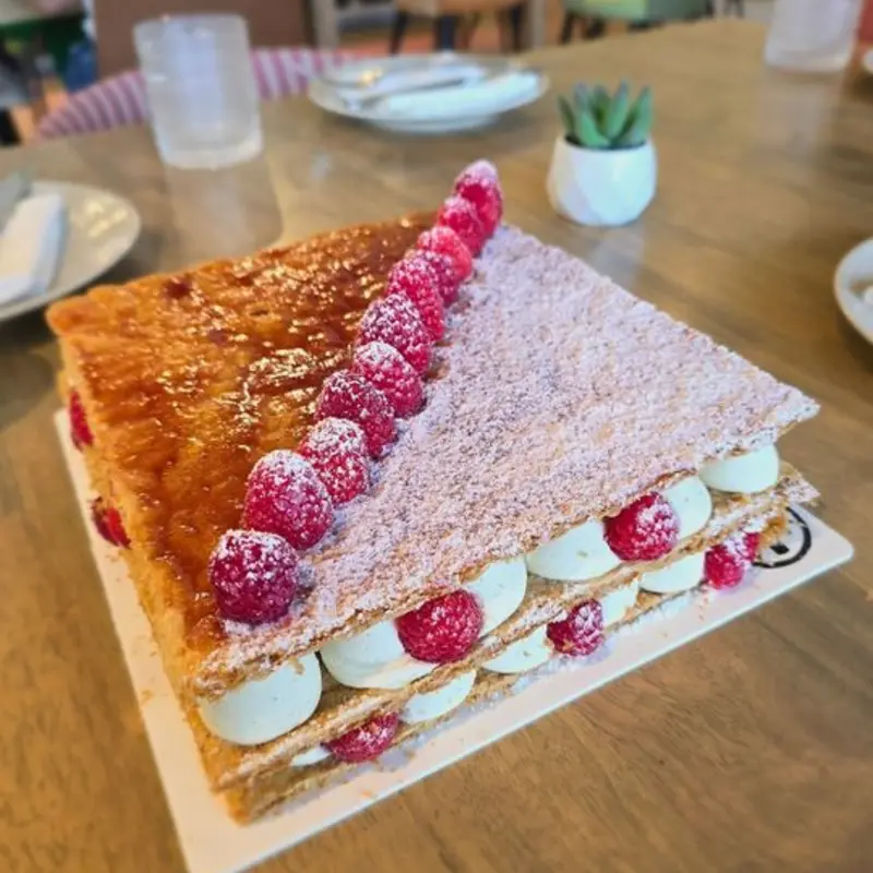 Stacked layers of puff pastry with vanilla pastry cream and filled with berriesServers 6 to 8 people. at CalaMillor Gourmet Experience | Toast