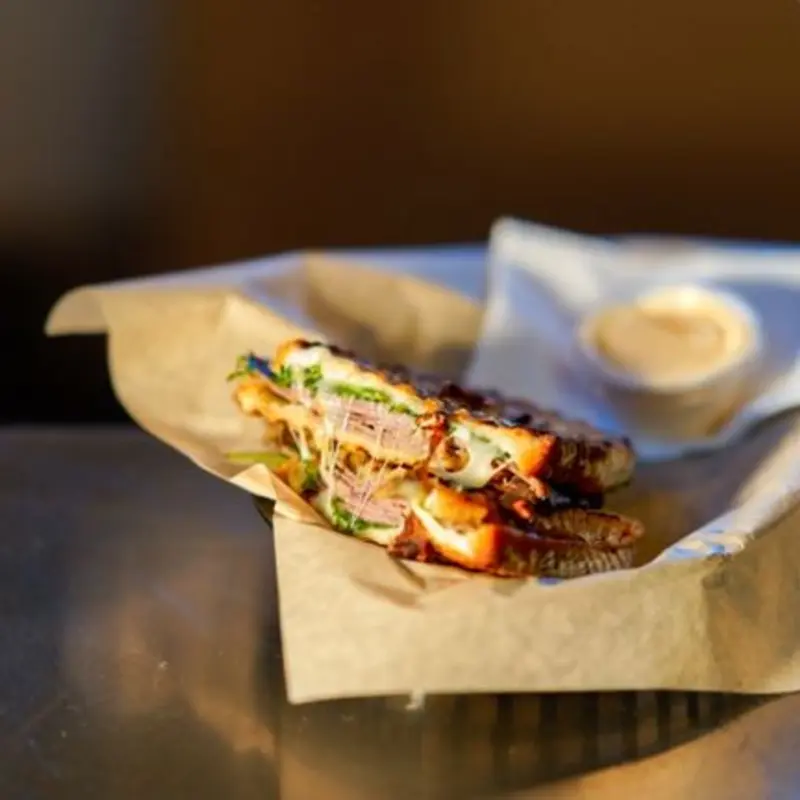 Roast beef, spicy horseradish, arugula, provolone, and onion jam spread.