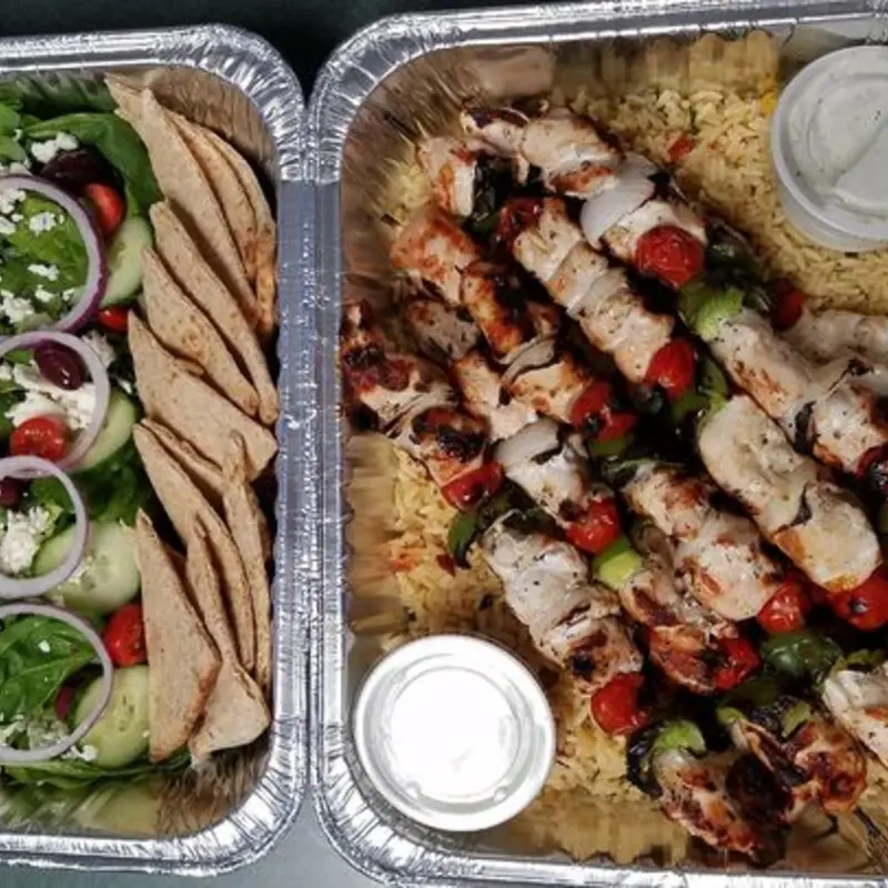 grilled marinated chicken skewer, rice pilaf, greek salad greens, tzatziki, grilled naan whole grain bread / Serves 10