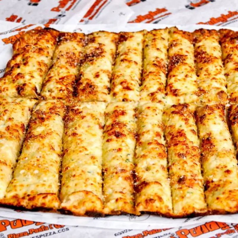 Pan of Cheesy Garlic Sticks at Pudgie's Pizza - Watkins Glen Watkins Glen | Toast