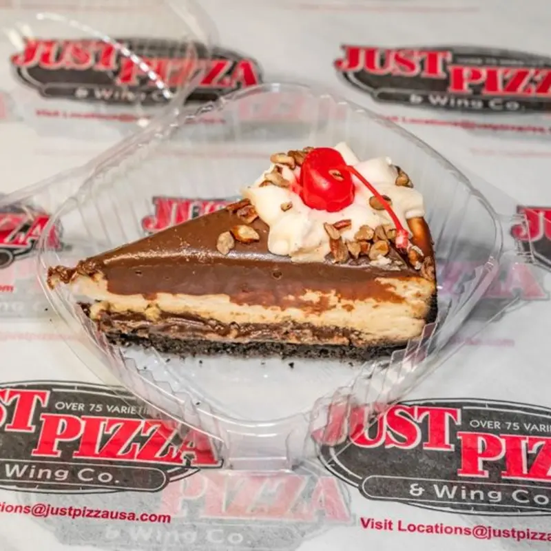 New York style cheesecake smothered with rich chocolate fudge. A dollop of whip cream, garnished with chopped pecans and topped with a cherry.