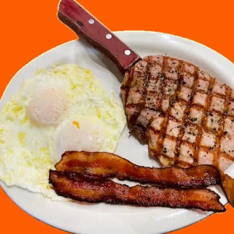 Juicy and full of flavor — this 8oz pork ribeye is grilled to perfection. at Granny's Kitchen - Pensicola 1124 W. Garden St. | Toast