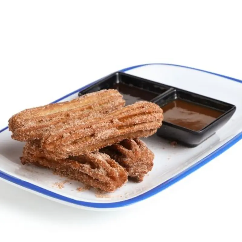 House-Made Fried Churros Rolled in Cinnamon Sugar served with Chocolate Mole and Caramel Dipping Sauce.