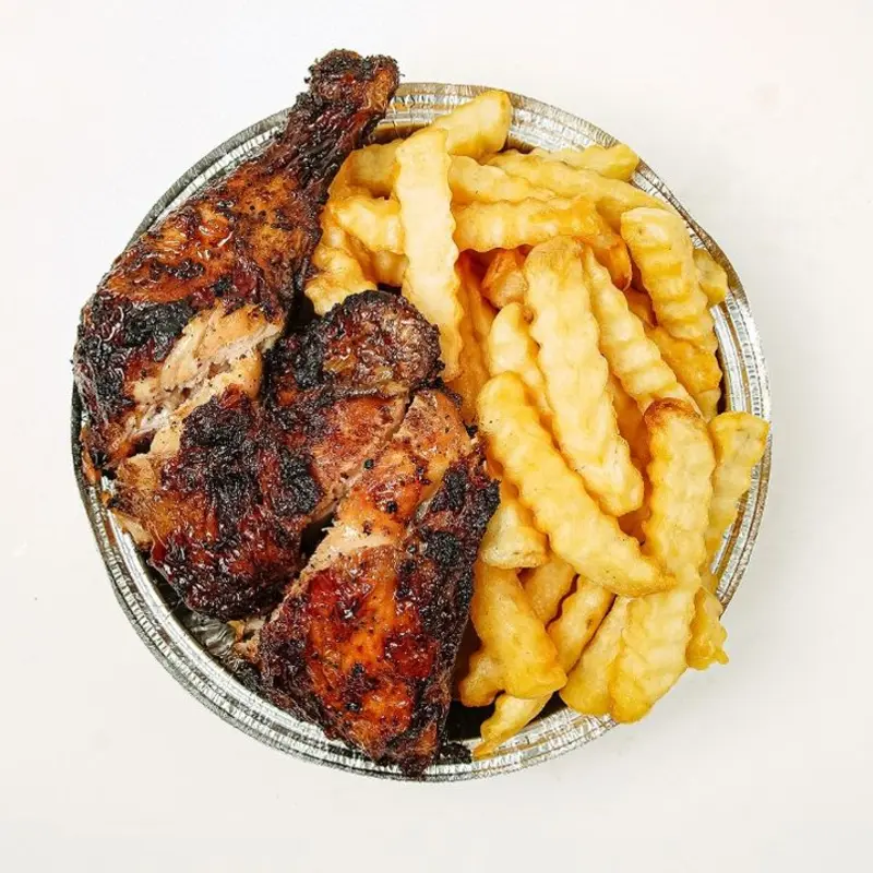 Jerk Chicken with French Fries at Peppa's Jerk Chicken | Toast