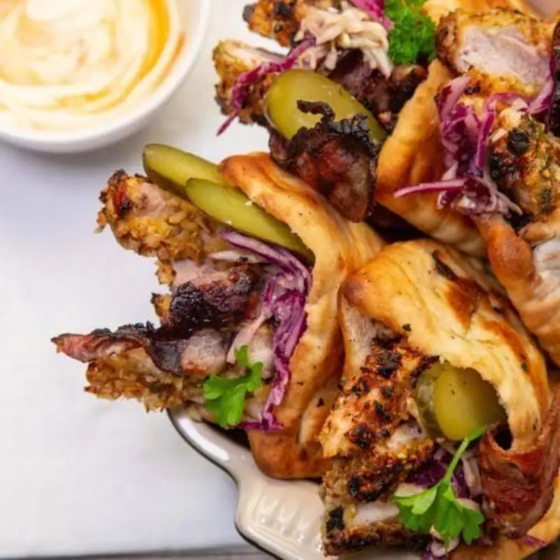 Chopped chicken leg combine with sauteed onion green cabbage pico de gallo along with garlic mayo BBC and sweet chili at Machne Yehuda 250 Kingston Ave | Toast