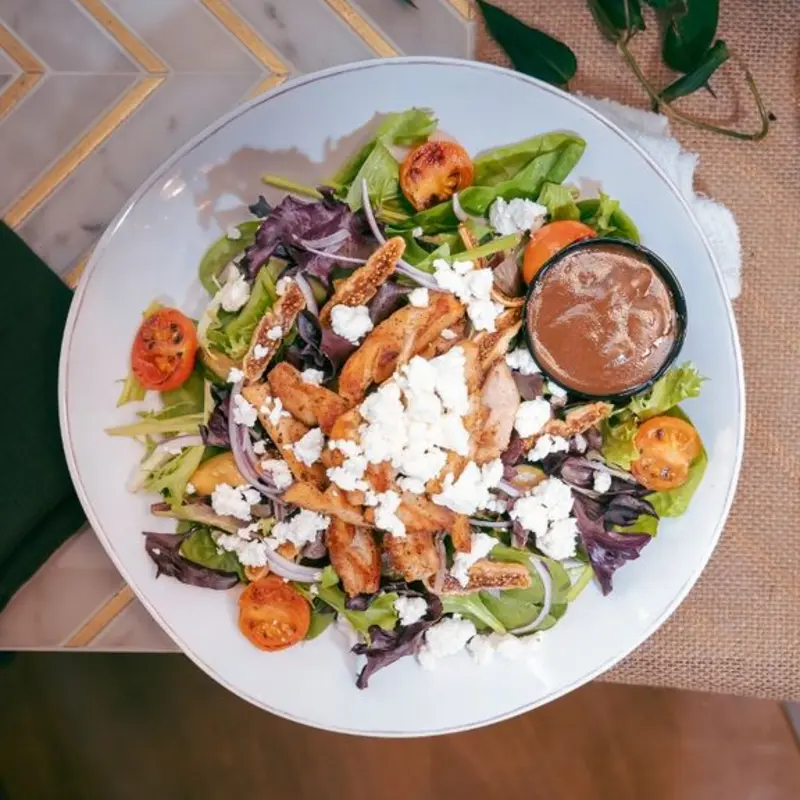 Chicken & Goat Salad at Artistry | Toast