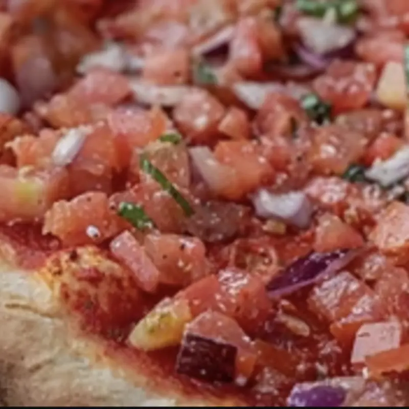 12" Cheeseless Bruschetta Pie at Zevy's Pizza