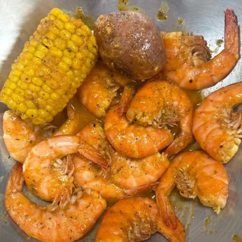 12 UNPEELED SHRIMP W/ 1 POTATO, 1 CORN at Bayou Seafood & More Houston