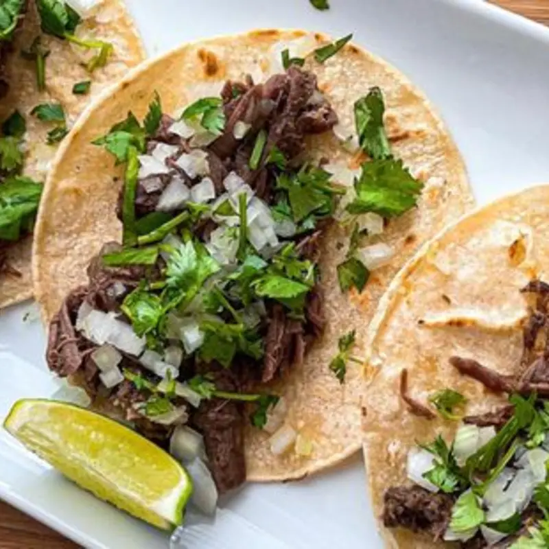 3 Tacos de Barbacoa (Beef) at Papo's Tacos 2402 Sheridan street Bay A