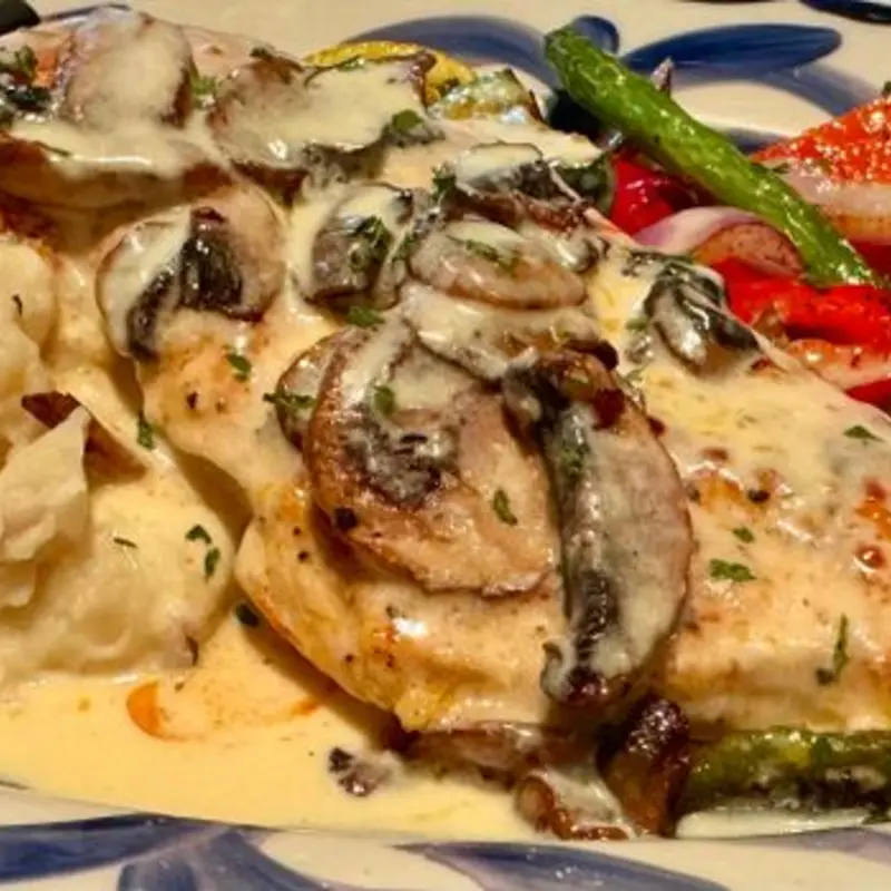 charbroiled lemon chicken at Tequila Rock LLC 2408 The Strand
